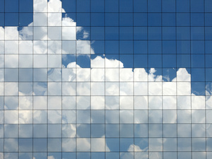 pixelated clouds reflecting on building windows